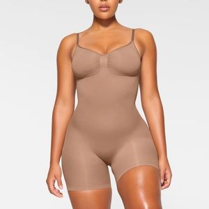 SKIMS Sculpting Seamless Mid Thigh Bodysuit in Ochre